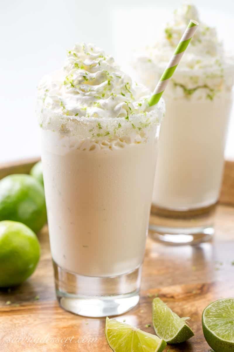 Margarita milkshake with whipped cream and grated lime zest