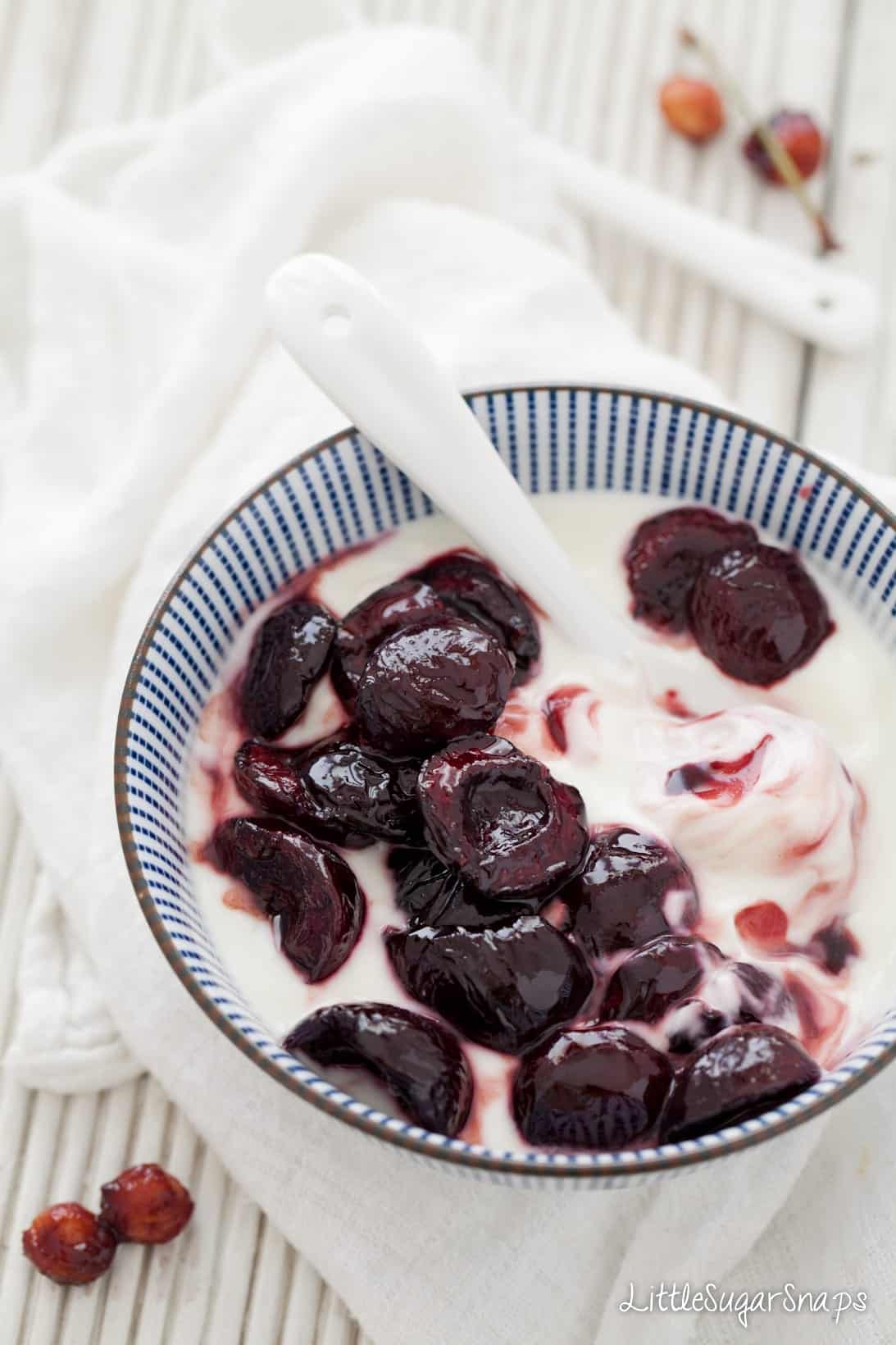 Roasted Cherries with yoghurt in a bowl.