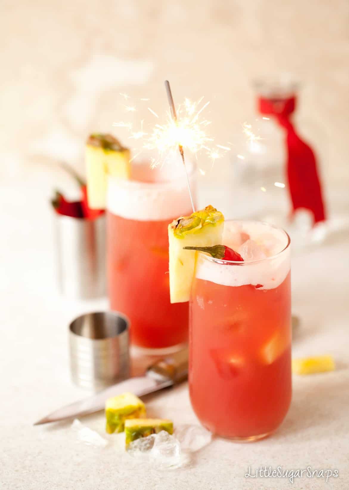 Chilli and cranberry cocktail with pineapple, chilli and a sparkler.