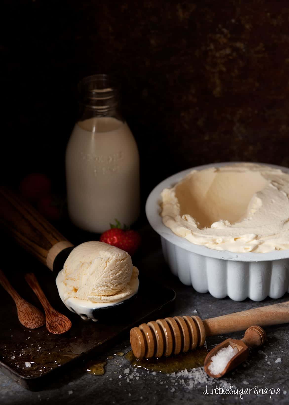 A tub of Salted Honey Ice Cream with ingredients alongside