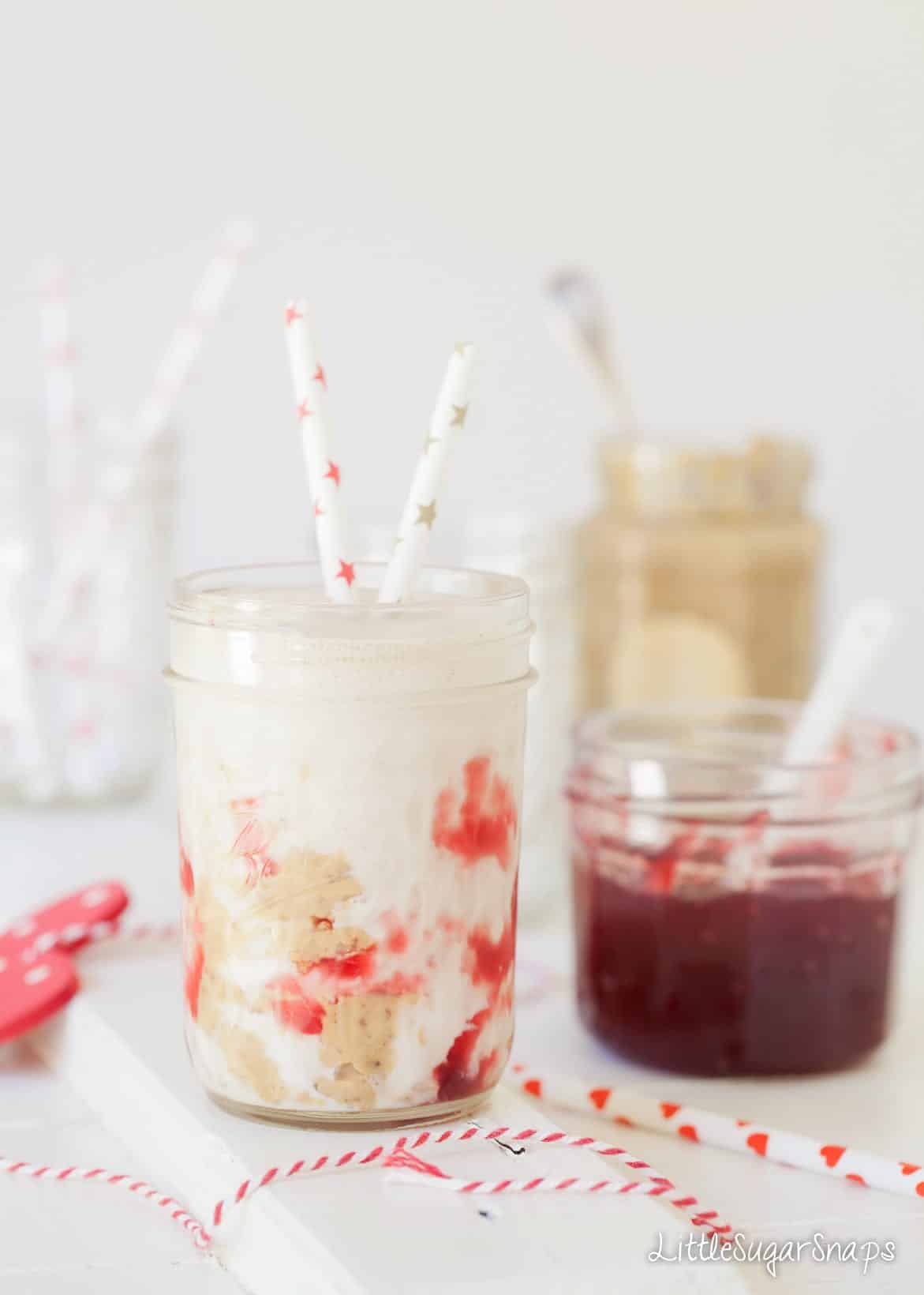 Peanut Butter and Jelly Milkshake with a jar of jam alongside.