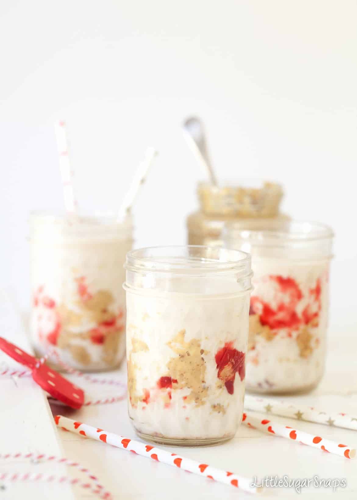 Three Peanut Butter and Jelly Milkshakes in jars