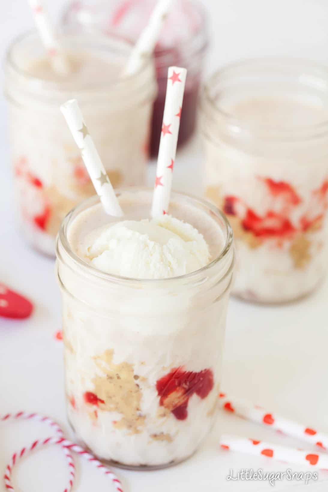 A milkshake topped with vanila ice cream