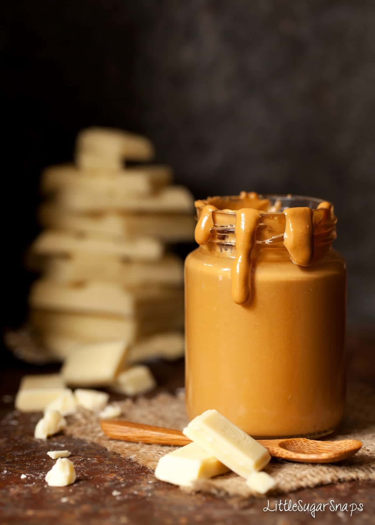 A jar of Caramelised White Chocolate with some dripping down the side.