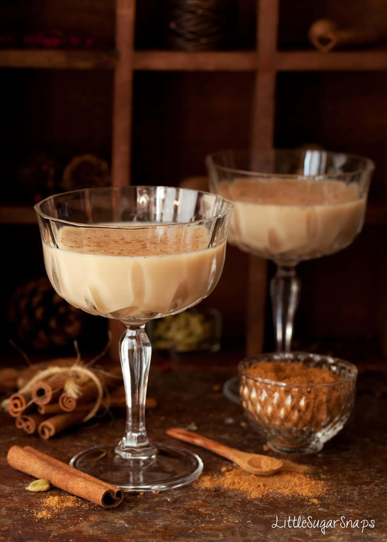 Glasses of Spiced Chai Latte Martini topped with ground spice