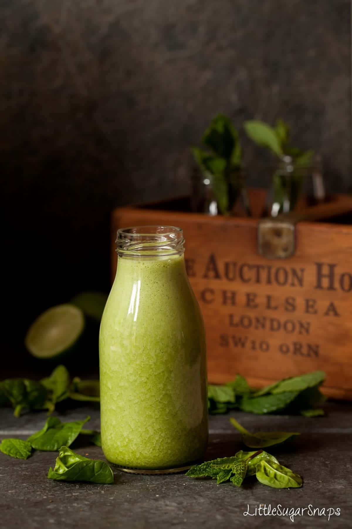 Mint Green Smoothie in a small milk bottle.