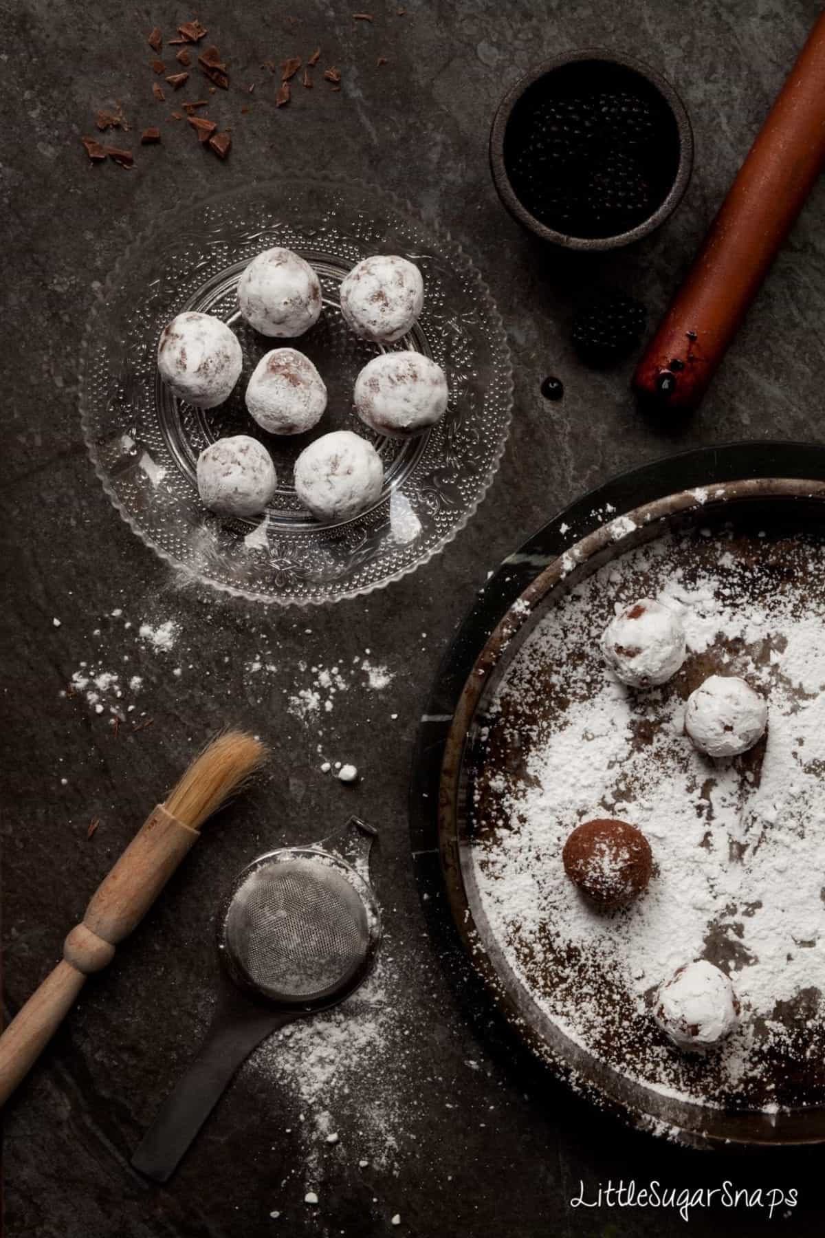 Bramble cocktail Truffles being rolled in icing sugar