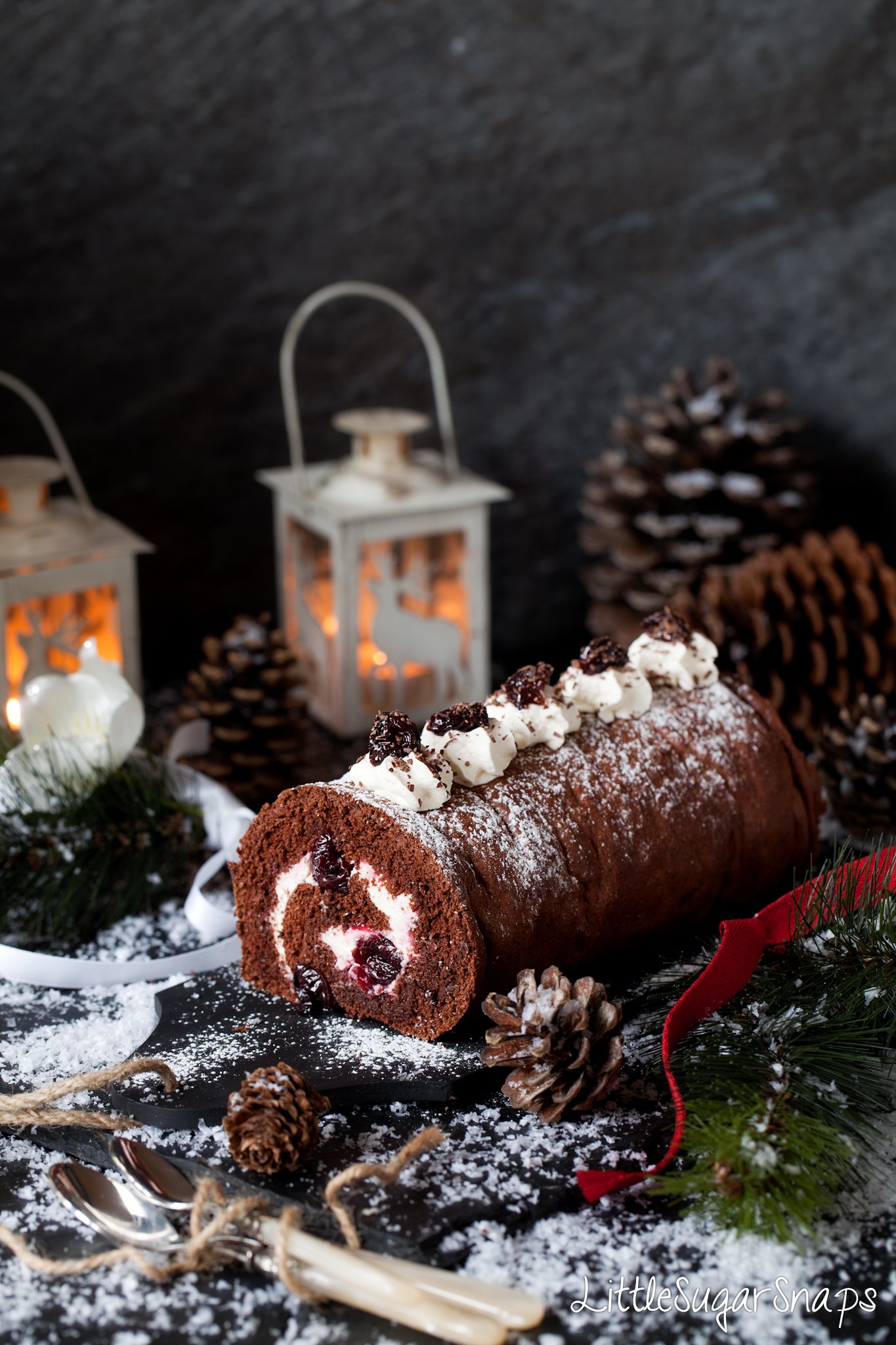 Black Forest Yule Log in a wintery snow setting .