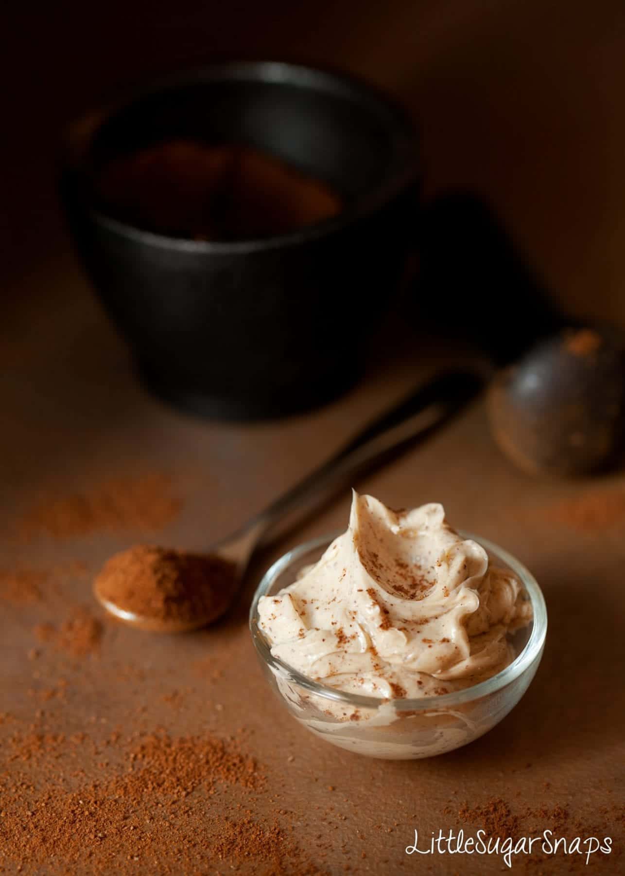 A small glass pot of whipped butter flavoured with cinnamon.