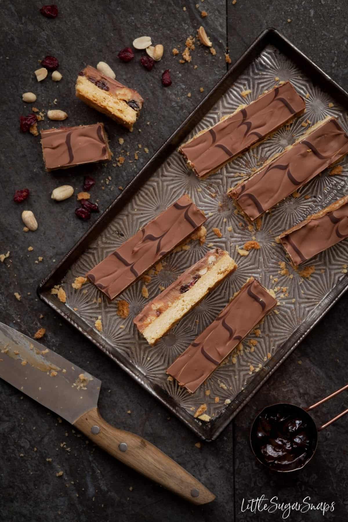 Millionaires shortbread bars with fruit and nut in the caramel.