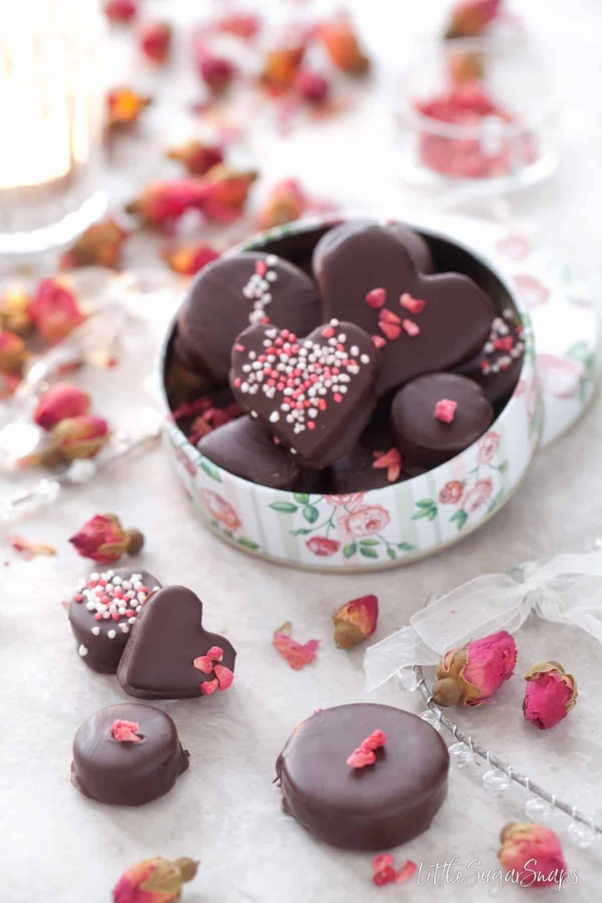 A floral tin holding homemade chocolates.