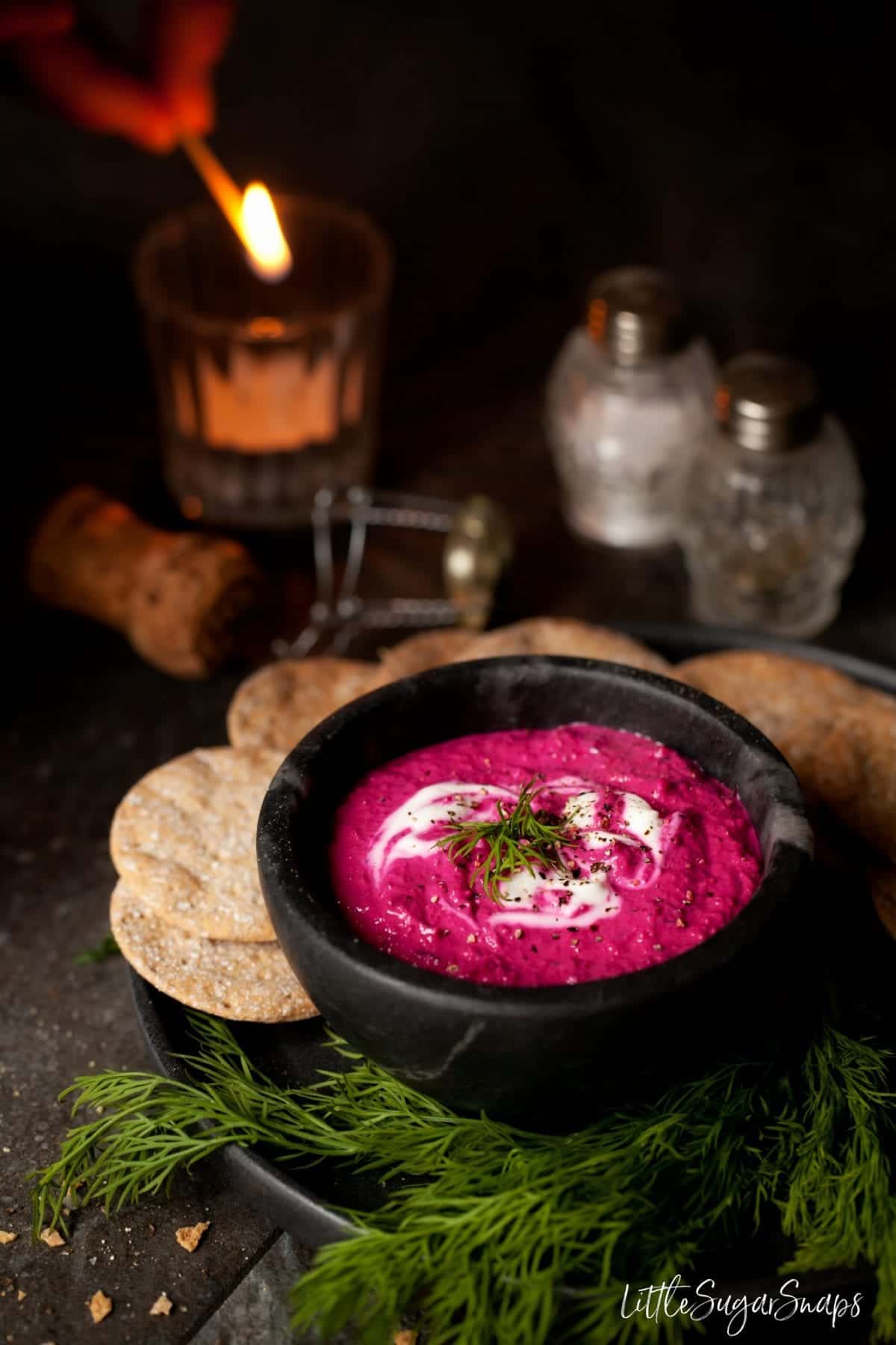 A bowl of Beetroot Tahini Dip with fresh dill.