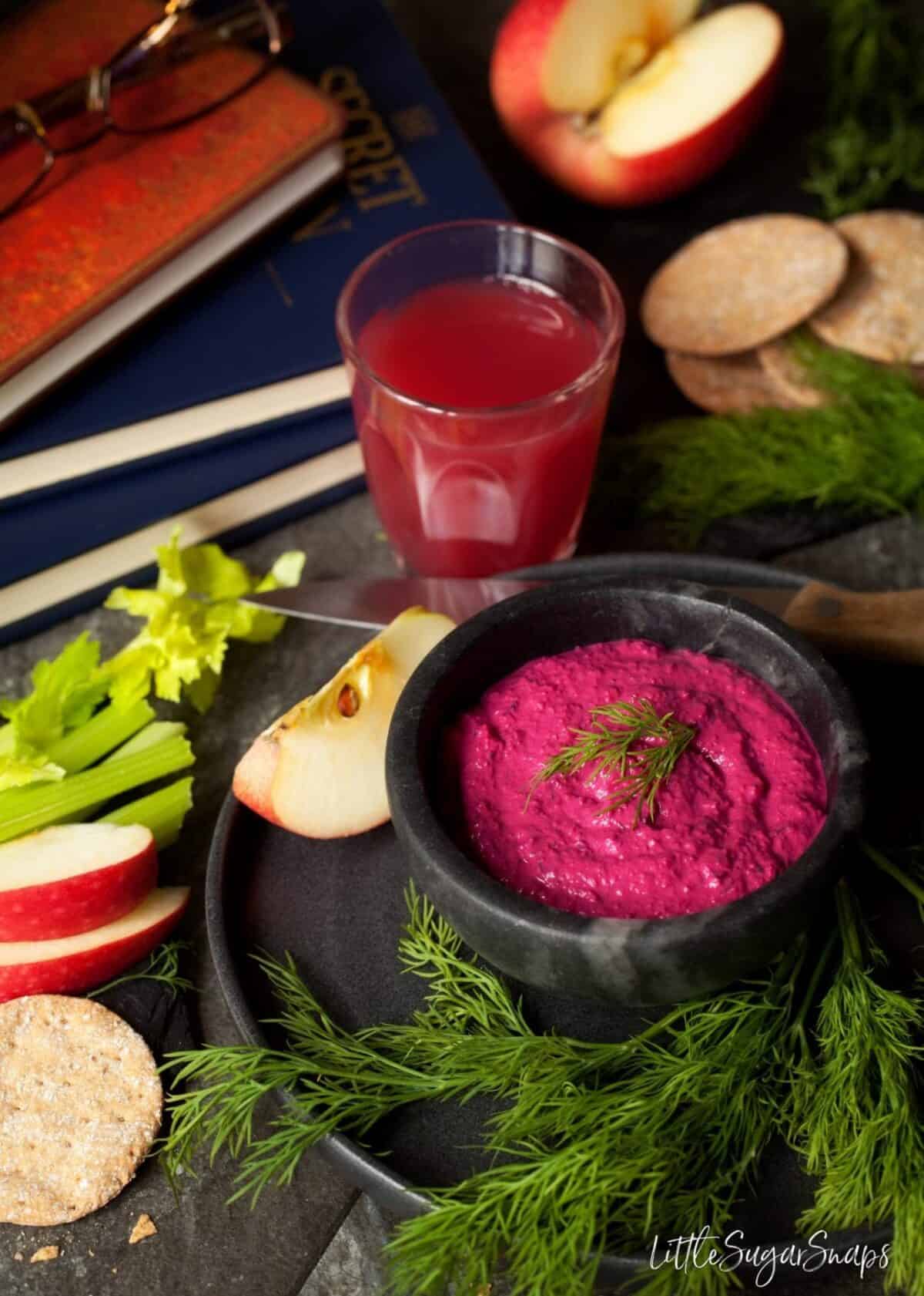 Beetroot Tahini Dip with apples, crackers and fruit juice.