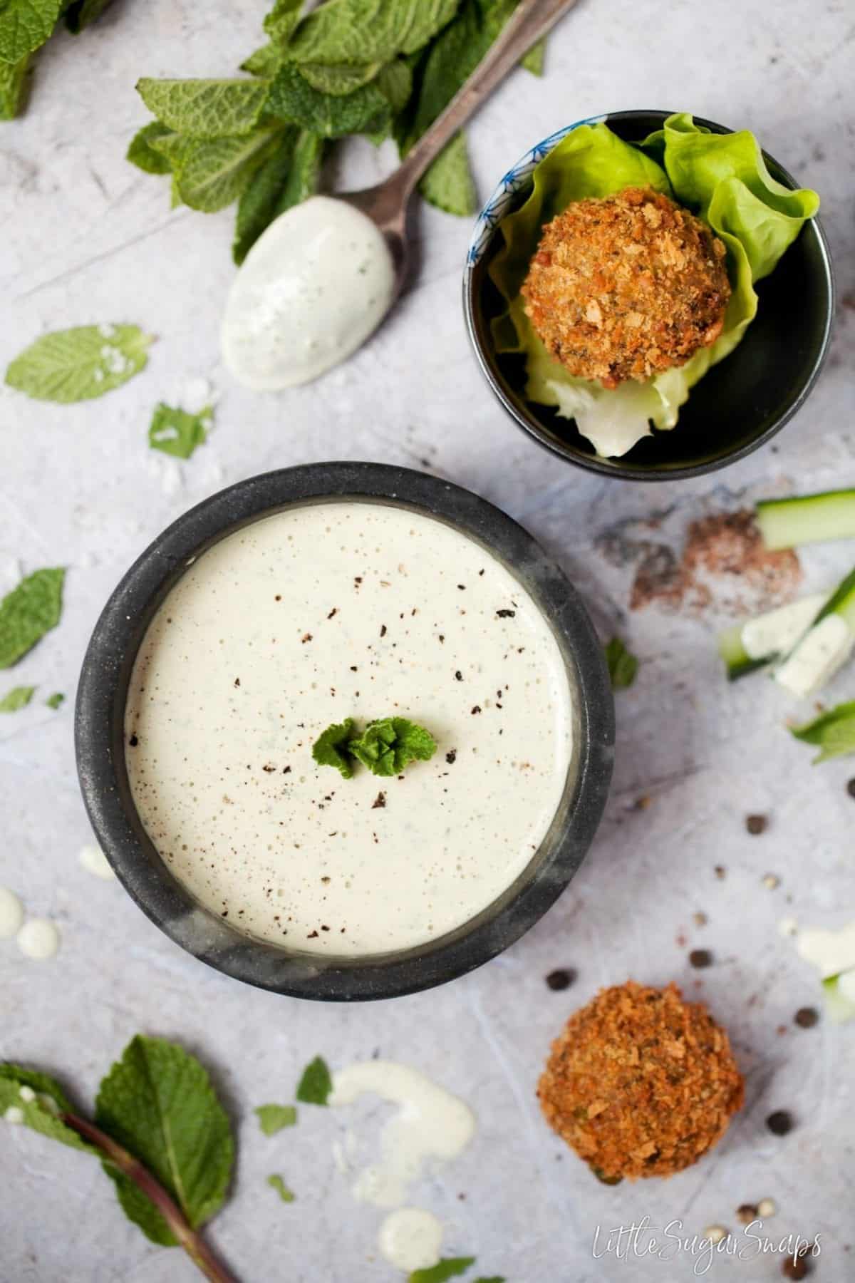 A bowl of mint and tahini sauce.