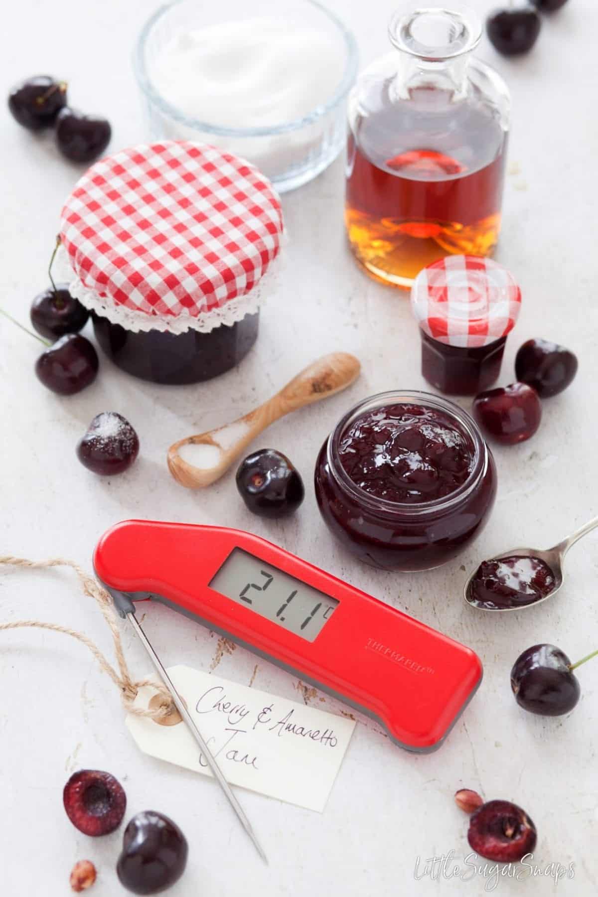 Amaretto Cherry Jam with fresh cherries and a digital food thermometer