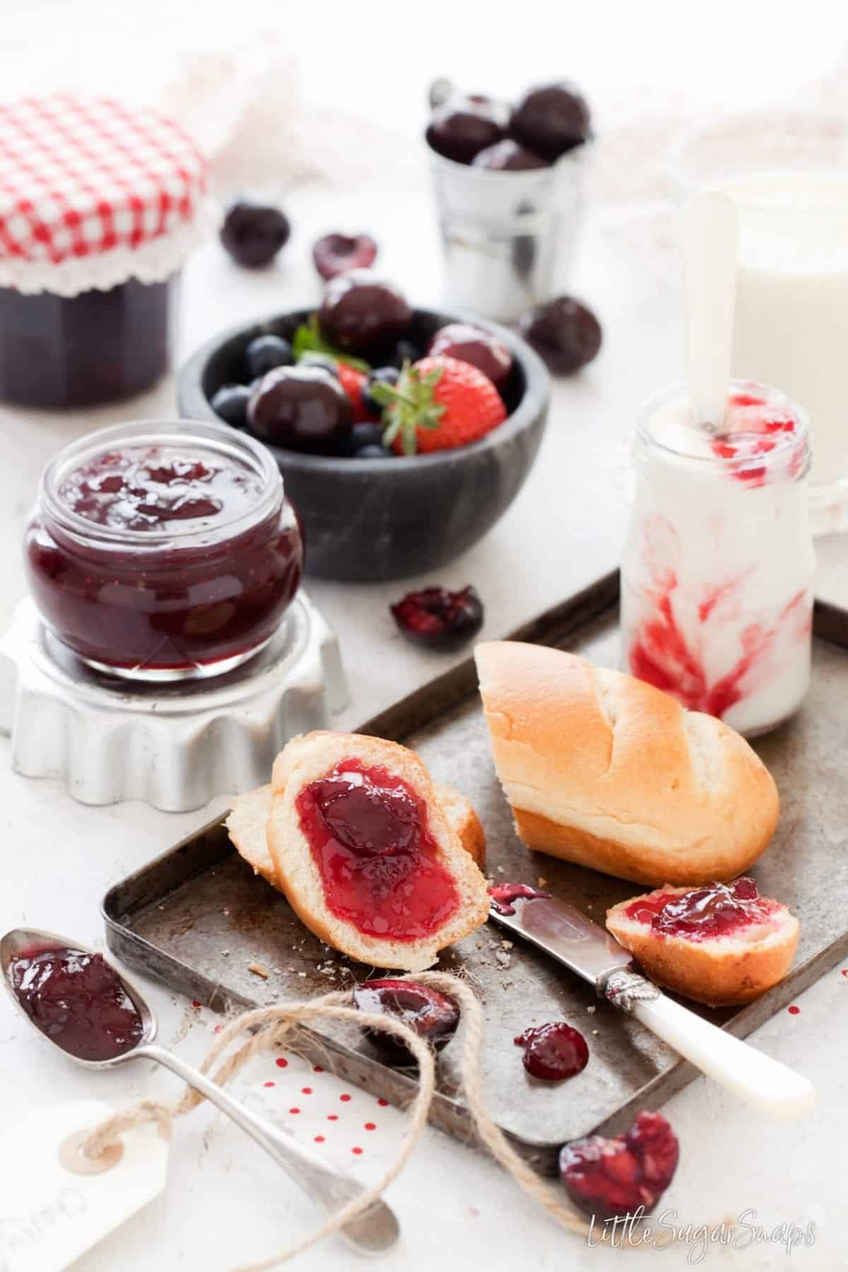 Cherry jam spread on brioche rolls