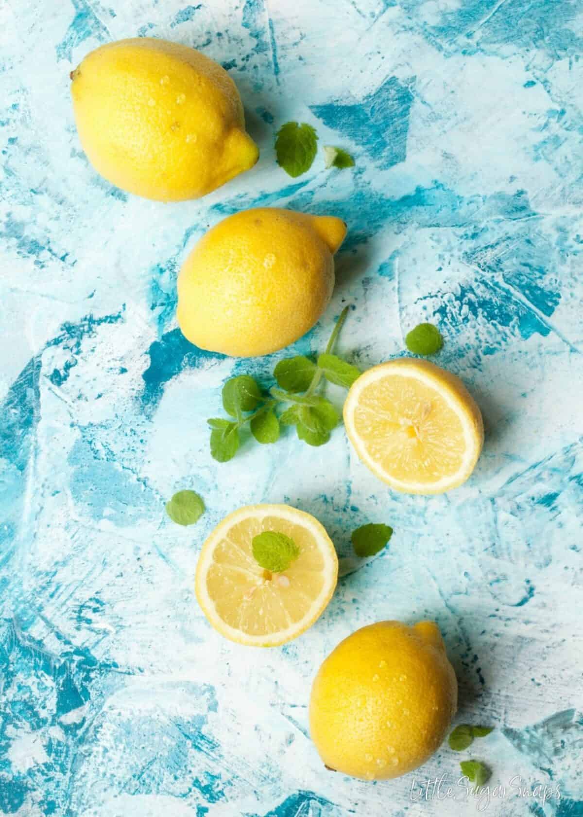 Lemons and mint on a blue background.