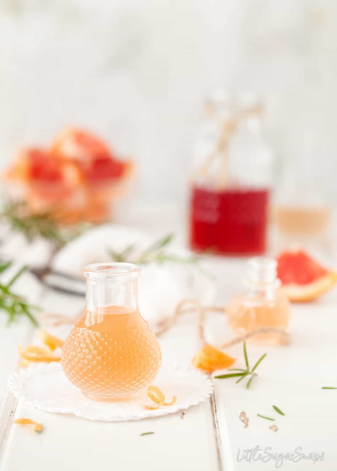 Grapefruit syrup in a small bottle.