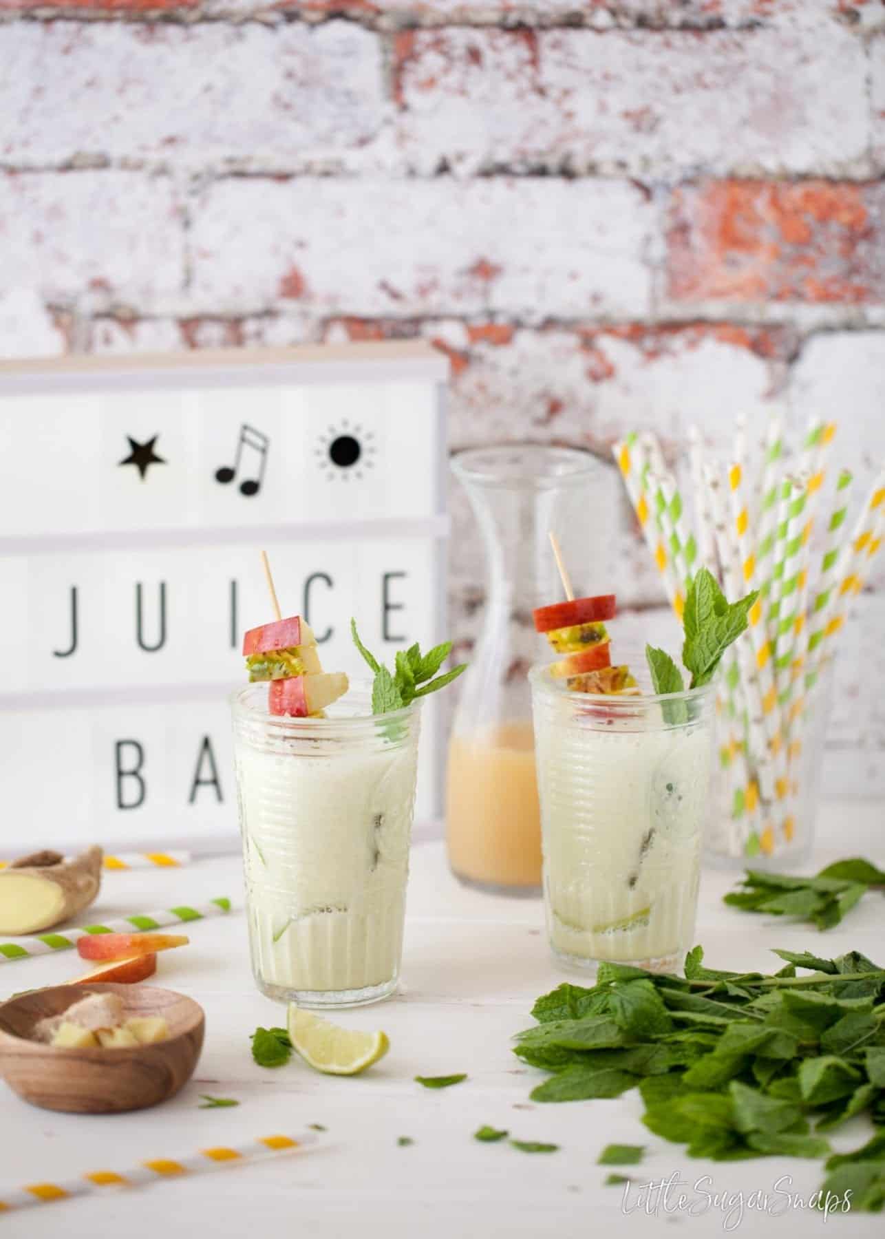 Two glasses of freshly made Apple Pineapple Ginger Juice