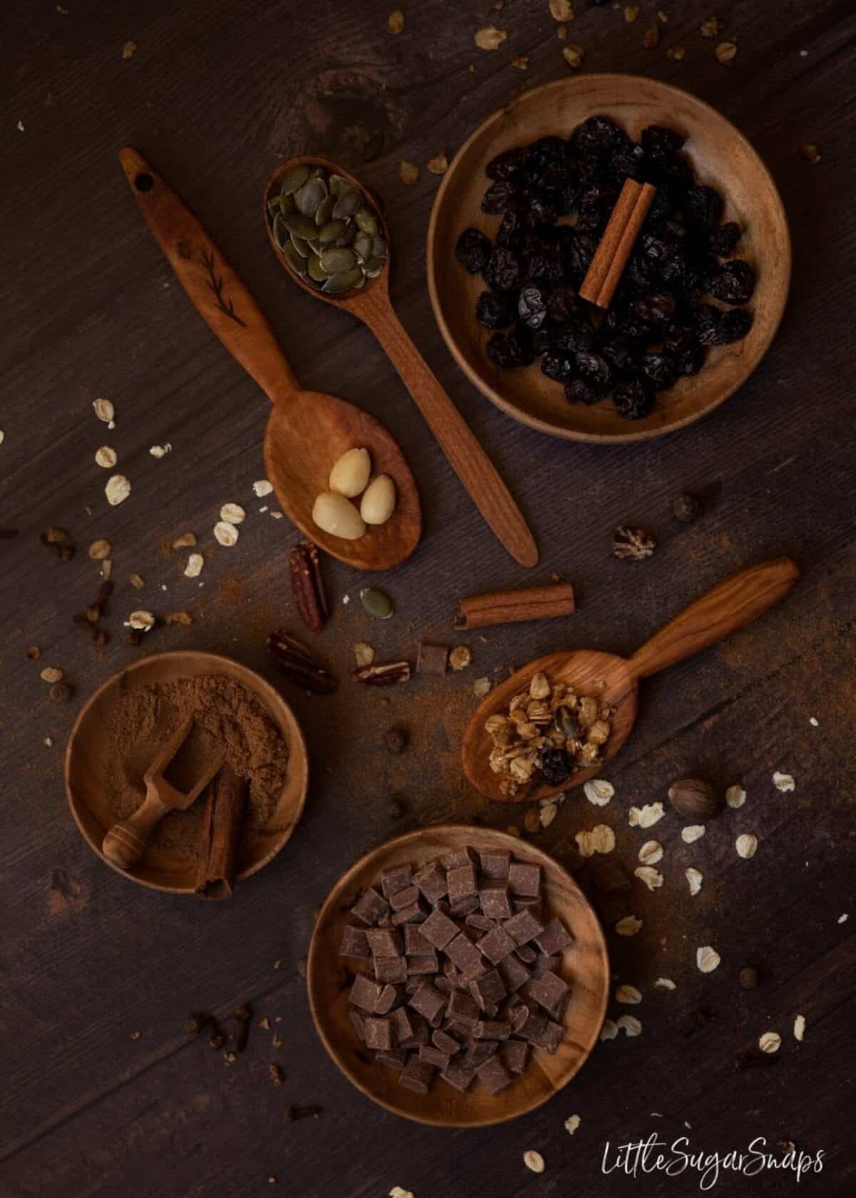 Ingredients for Chocolate Pumpkin Spice Granola: chocolate, spice, nuts, seeds and raisins.