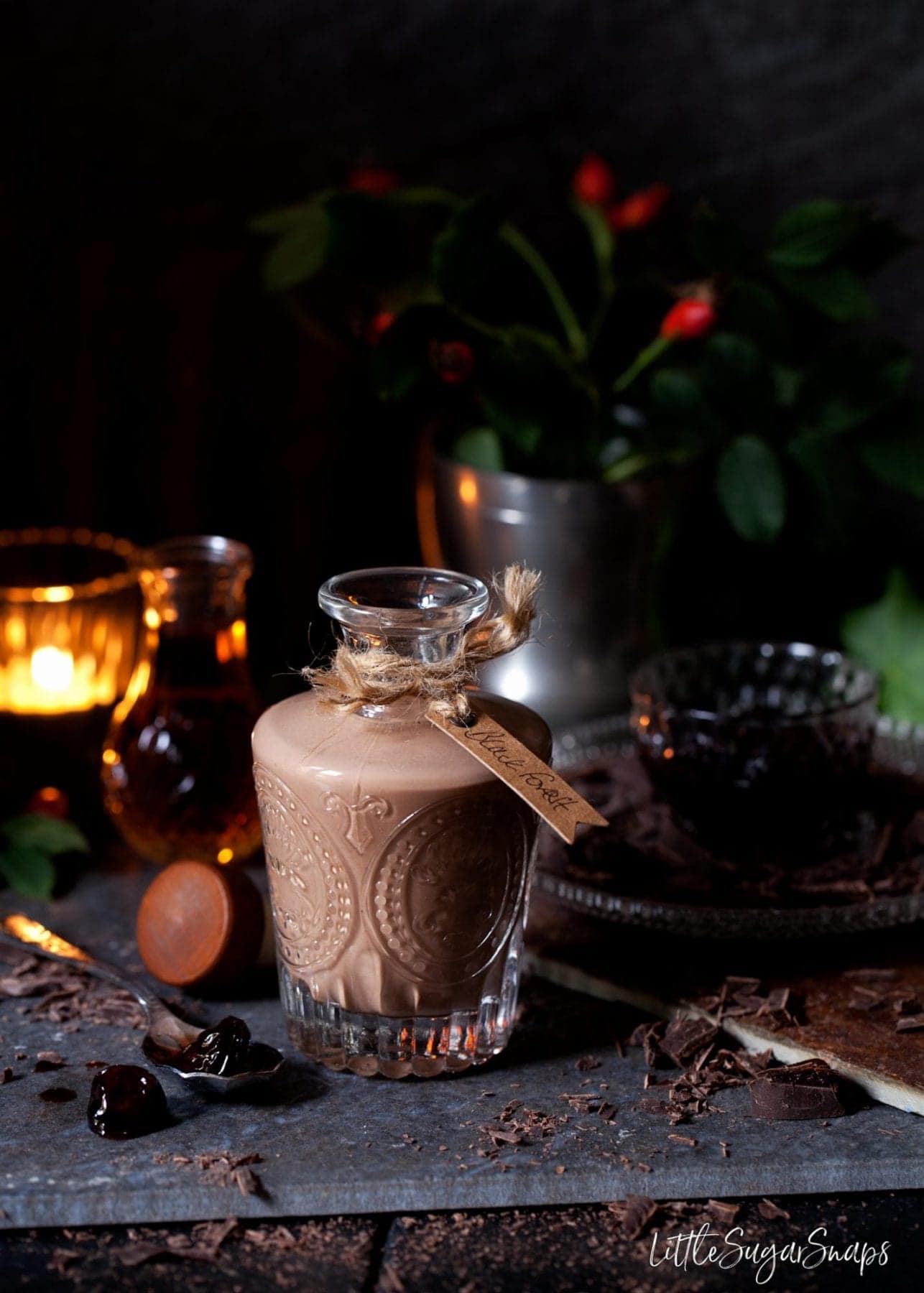 Homemade Chocolate Liqueur in a vintage embossed bottle with a gift tag on it. 