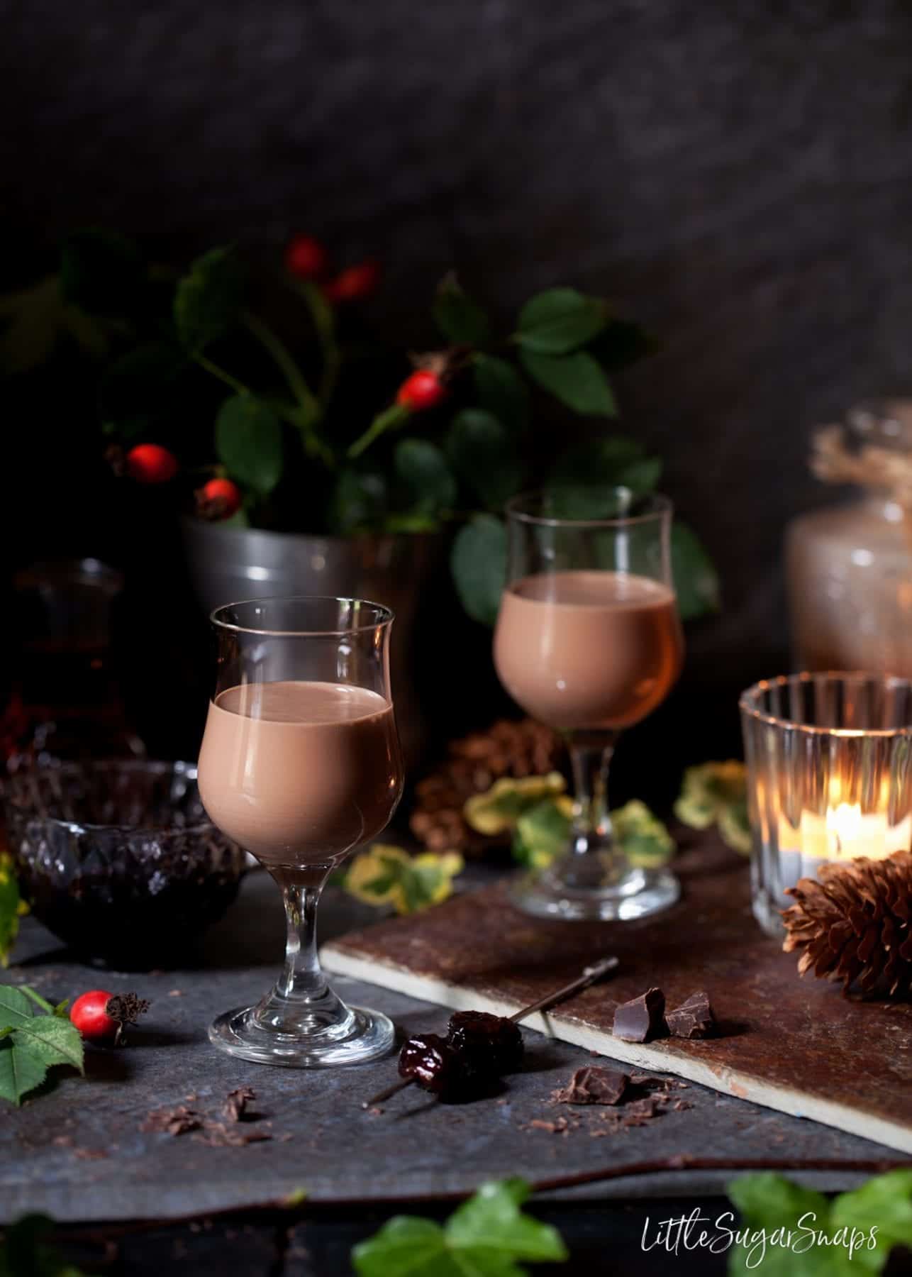 Two glasses filled with alcoholic chocolate cream liqueur drink.