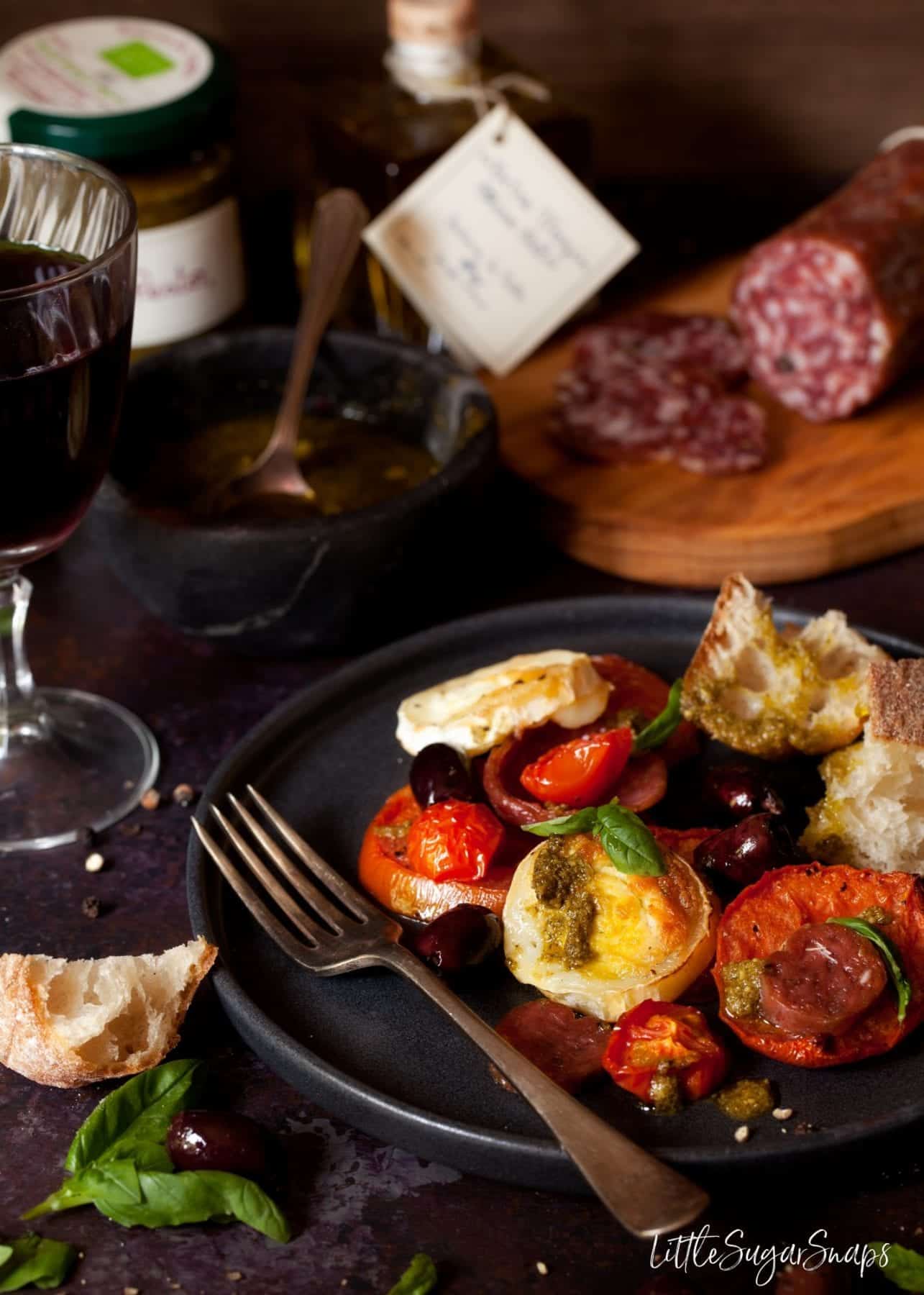 Baked Tomato, Goats Cheese, salami and olives with crusty bread.