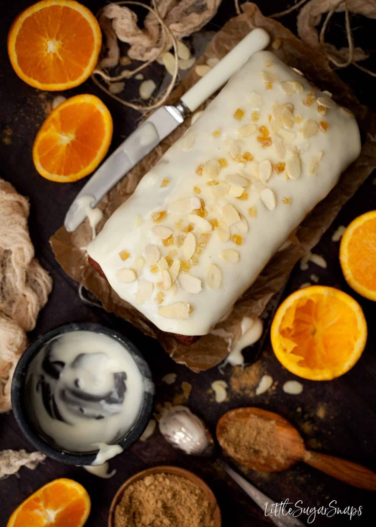 Overhead view of an iced loaf decorated with flaked almonds