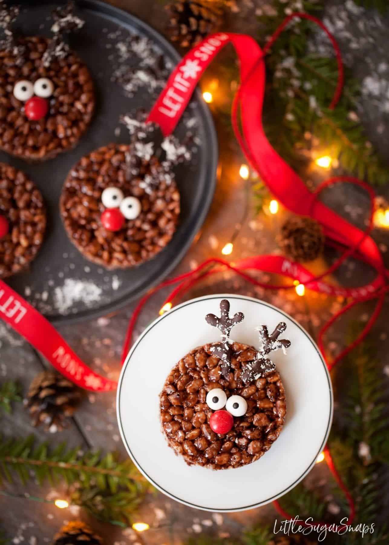 A Rudolph themed Chocolate Rice Krispie Treat on a plate.