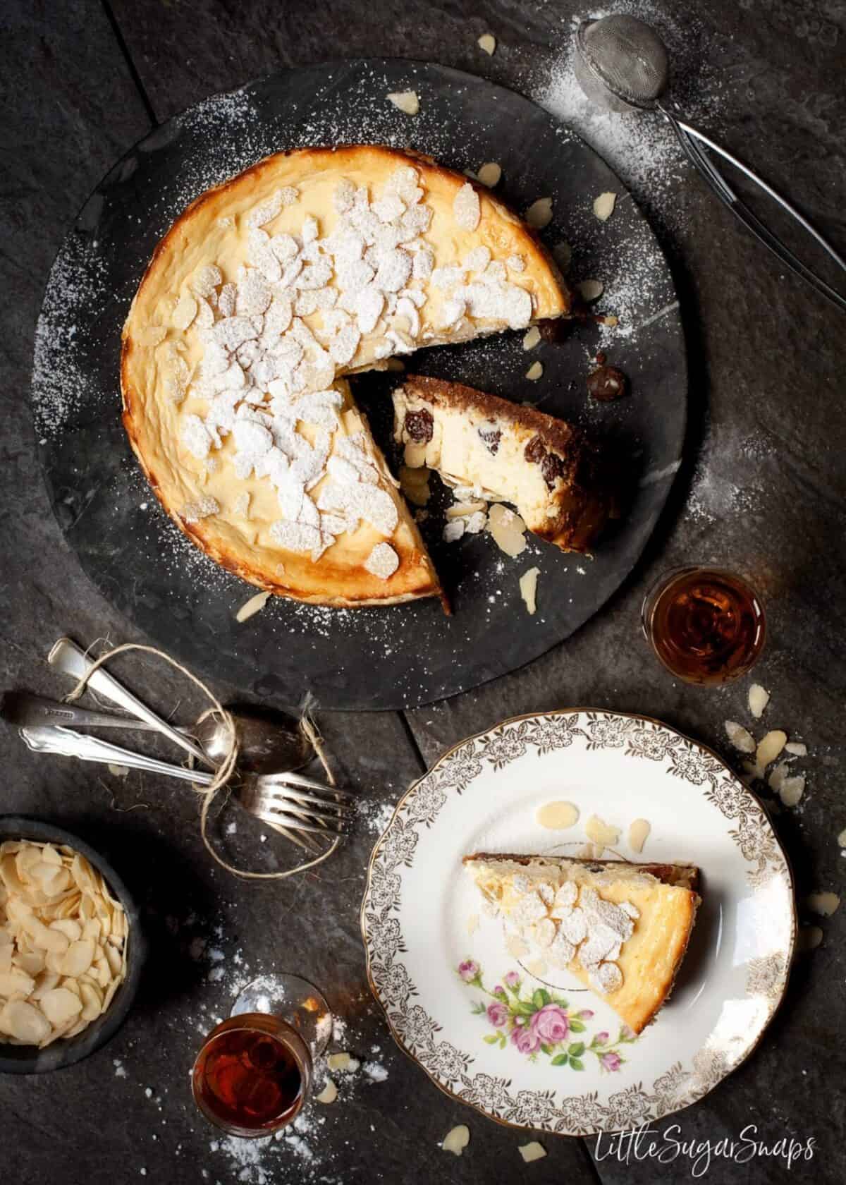 Overhead view of Italian Ricotta Cheesecake topped with flaked almonds.