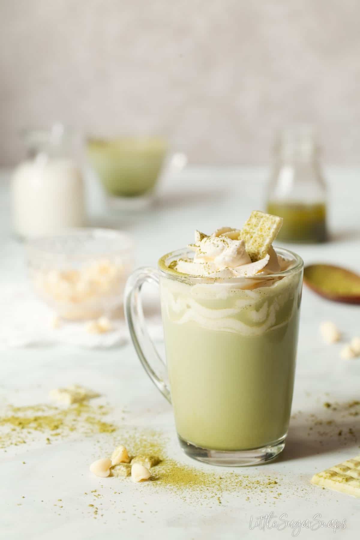 Chocolate matcha in a heatproof glass with whipped cream