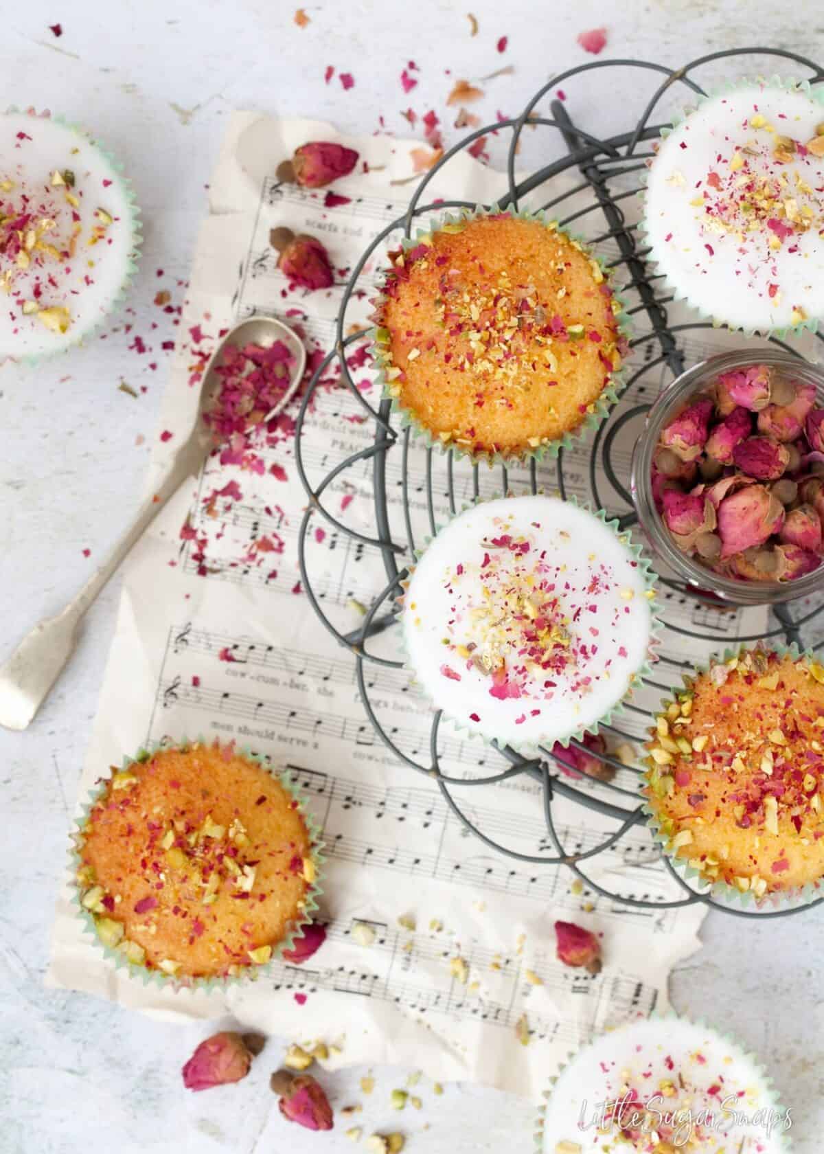 Persian Love cake Cupcakes on a wire rack.