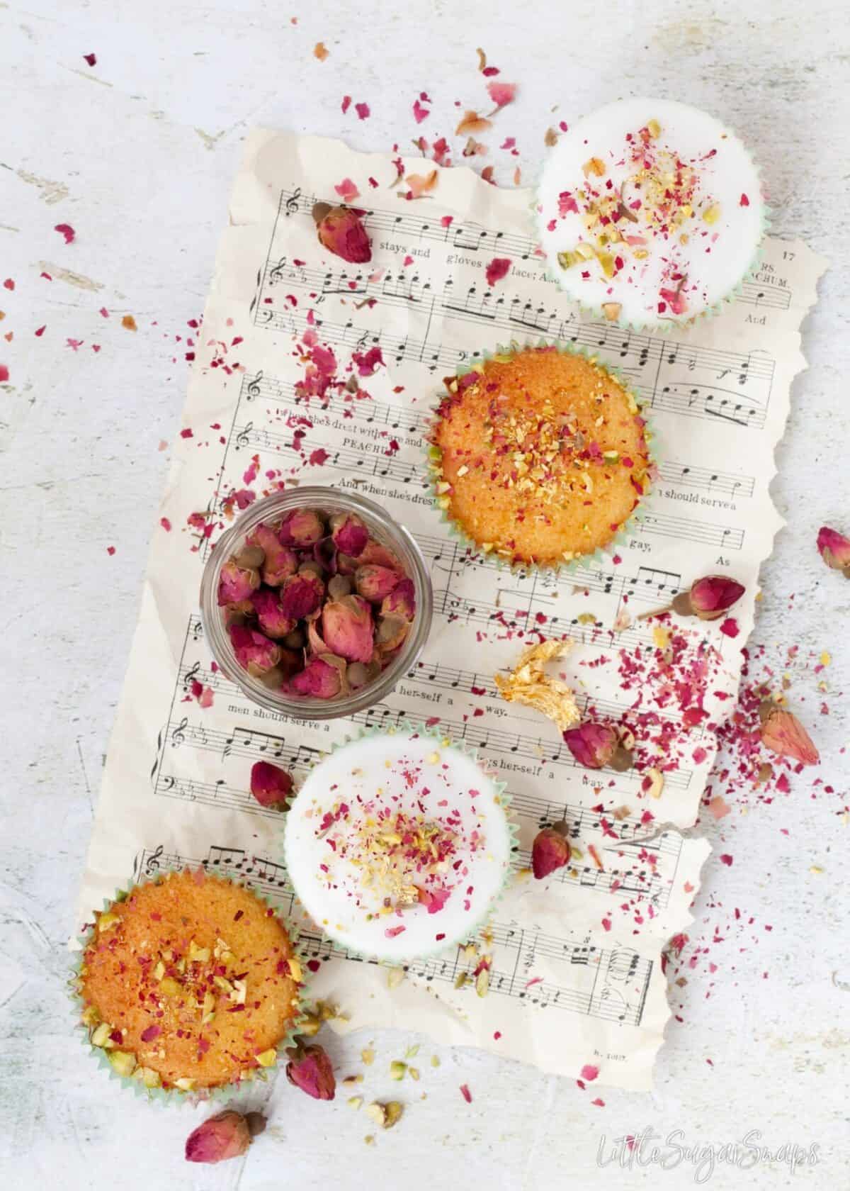 Persian love cake in cupcake form - some decorated with white icing.