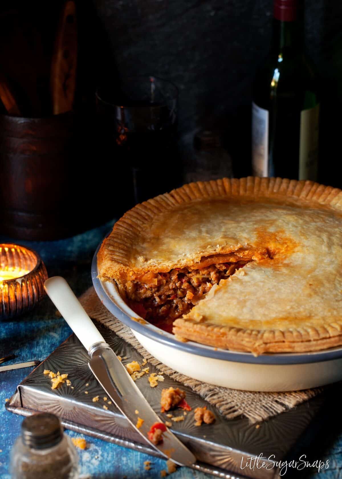 Mediterranean Lamb Pie with a slice taken out.