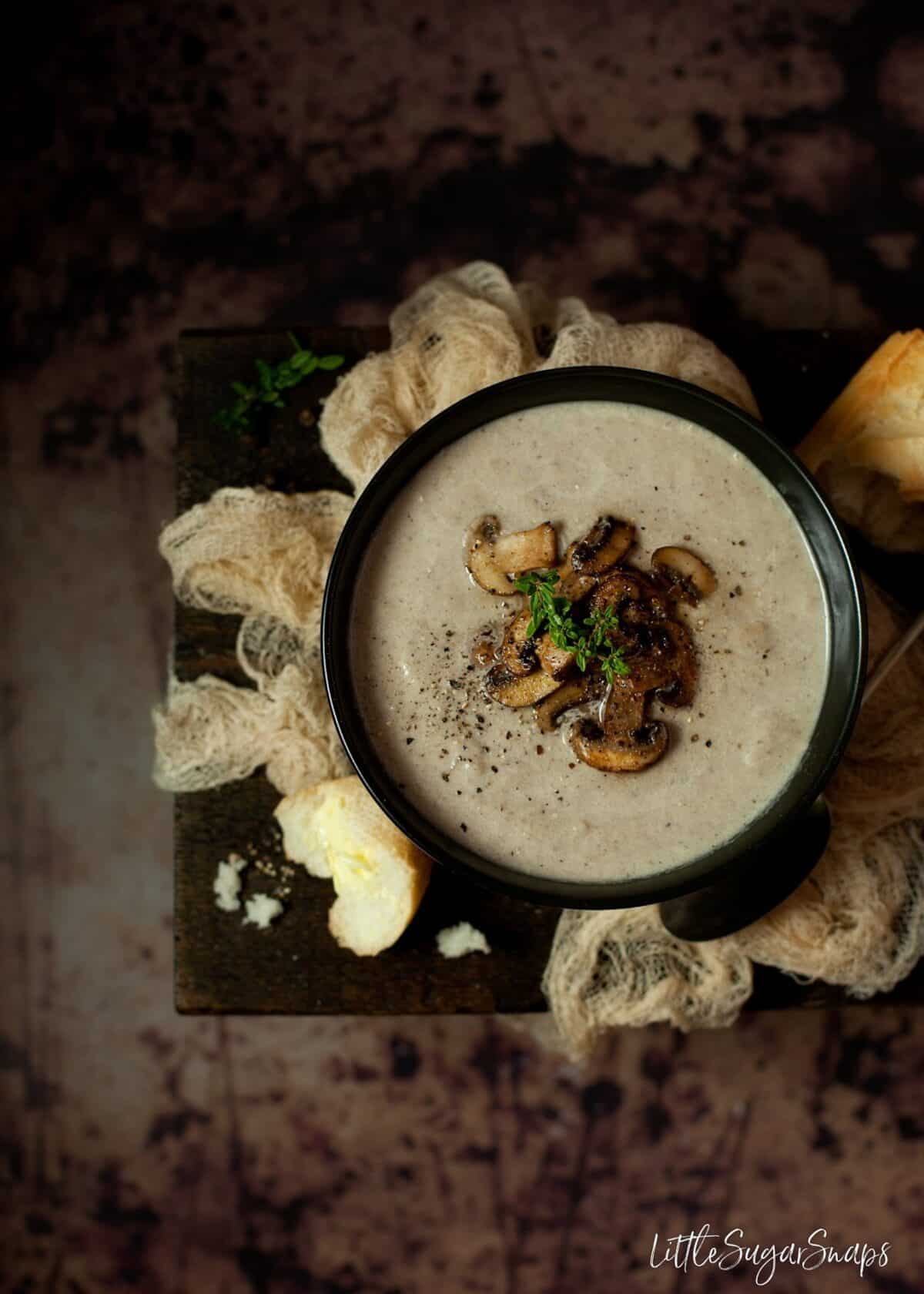 Mushroom thyme Blue Cheese Soup garnished with fried mushroom slices.