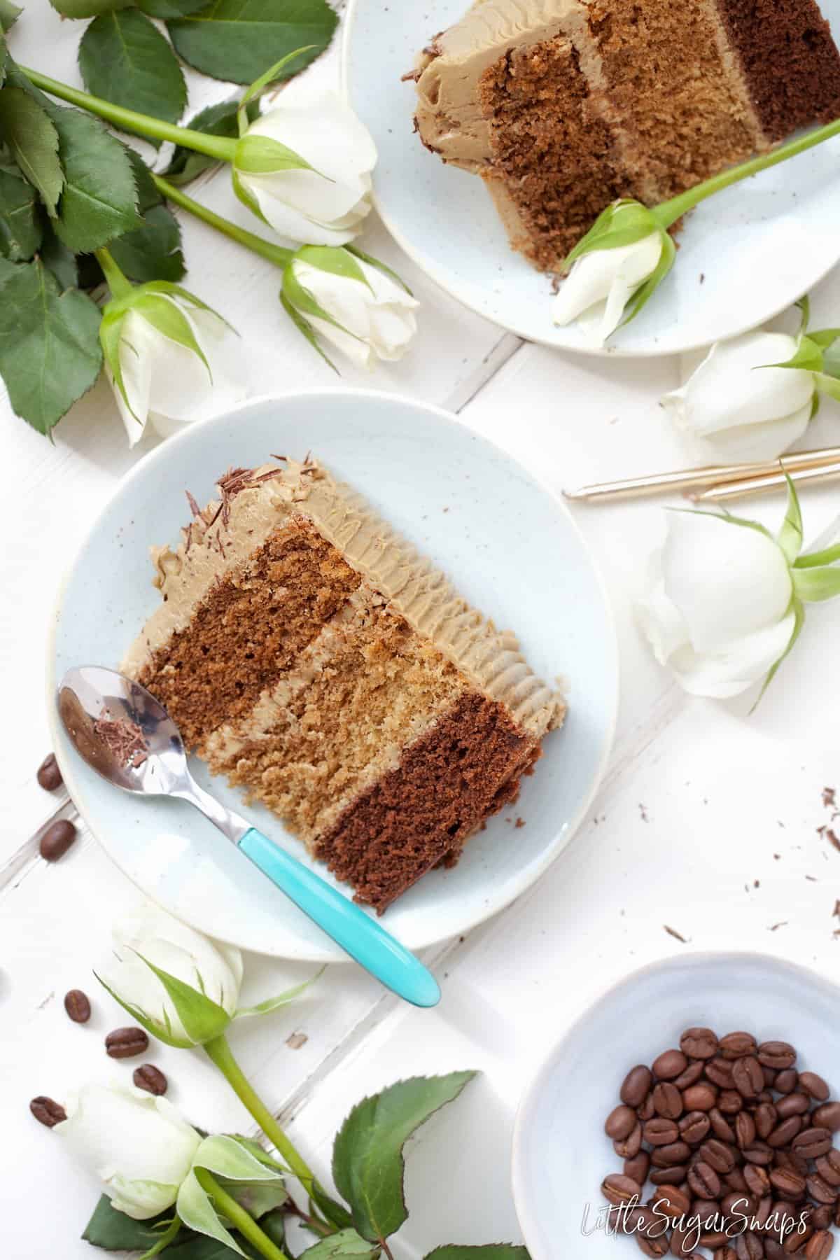 Slices of a coffee flavoured sponge cake on plates