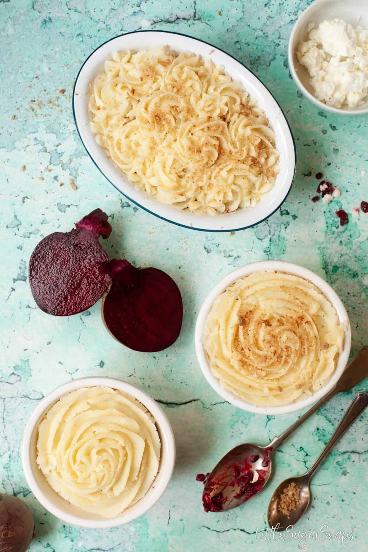 Potato topped individual pies with beetroot at the side.