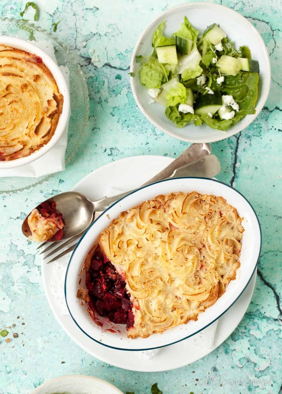 Black Lentil Beetroot Pie with a piece taken out.