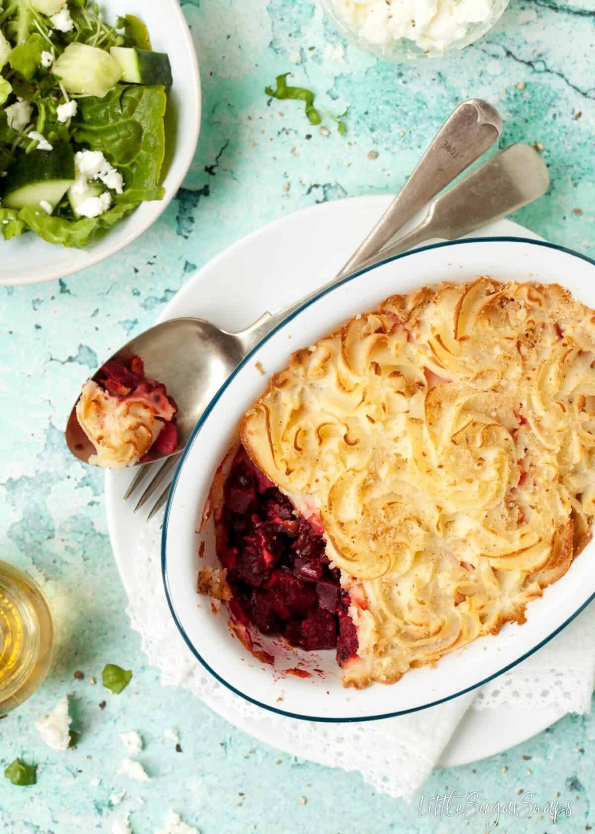 Black Lentil Beetroot Pie with a spoonful taken out.