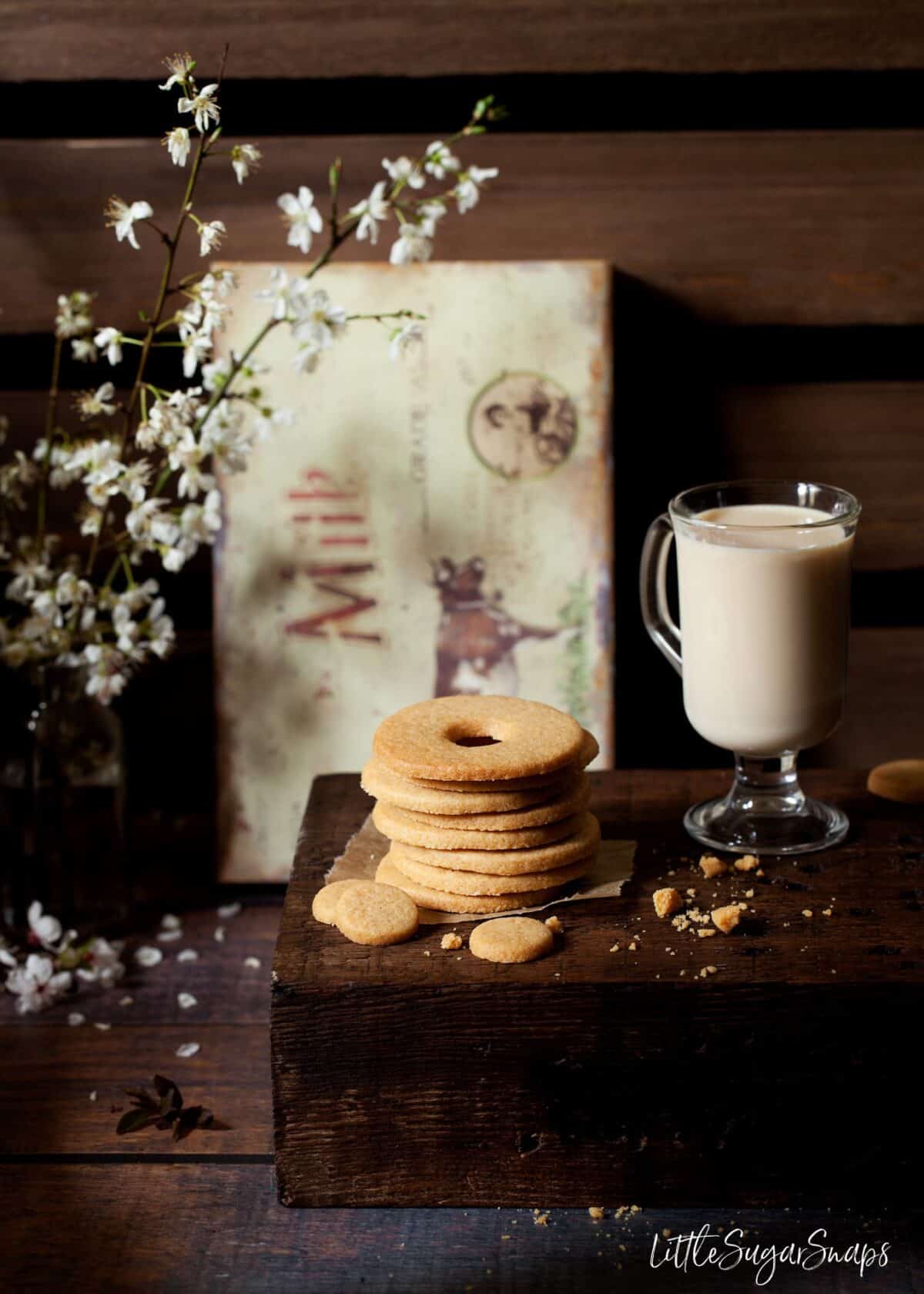 A stack of Malted Milk Biscuits on a wooden board.