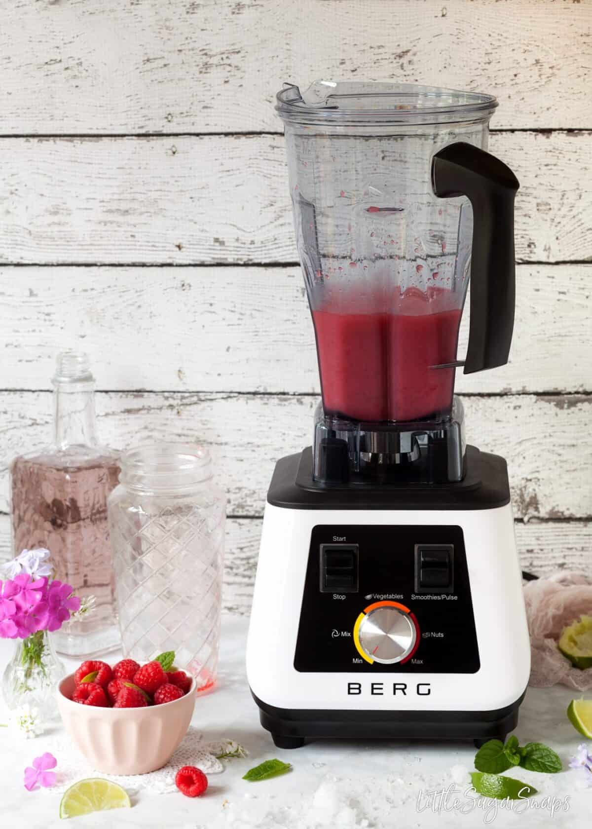 Making  a raspberry drink in a Berg Innovations blender