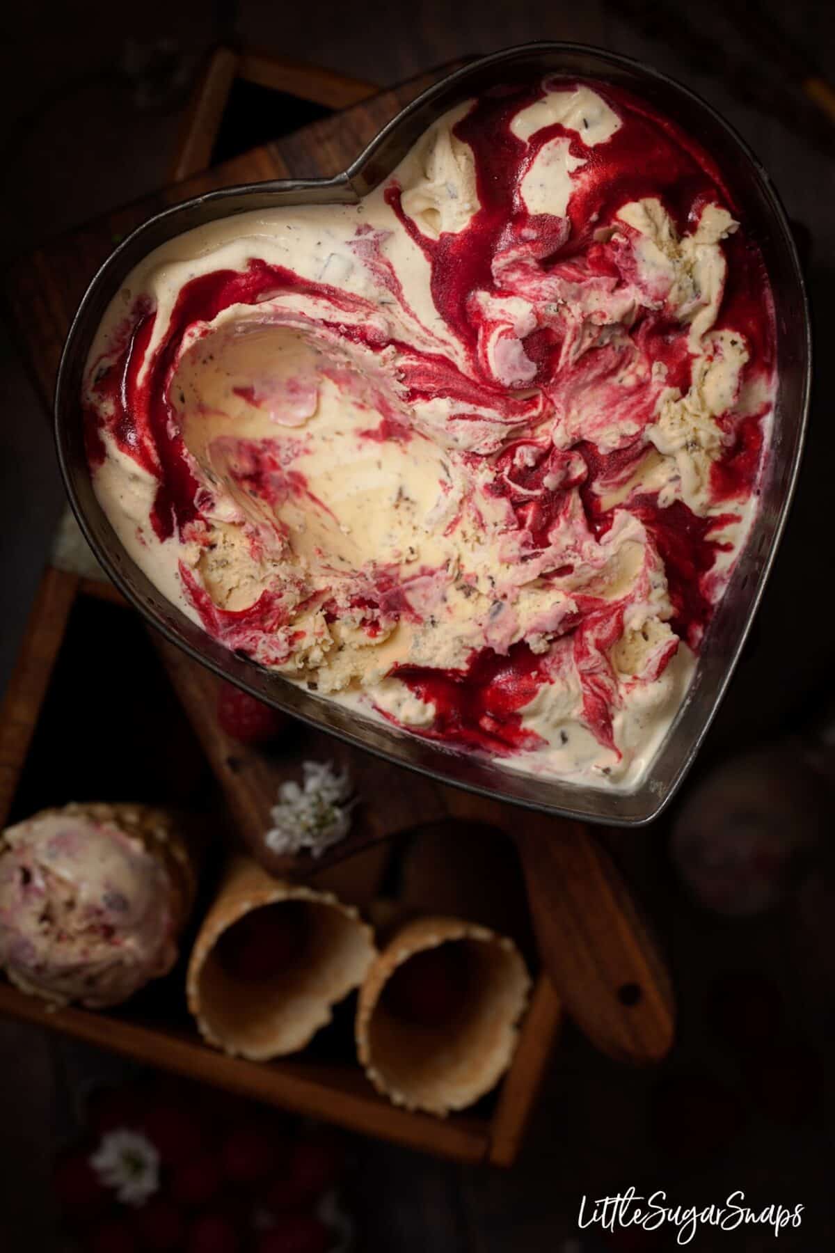 Malted Milk Ice Cream with chocolate chips and raspberry ripple in a heart shaped tin.