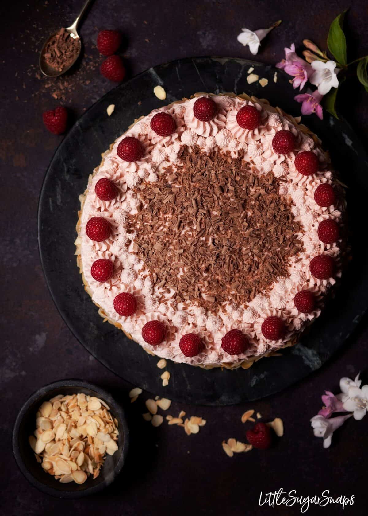 Overhead view of a raspberry dacquoise cake.