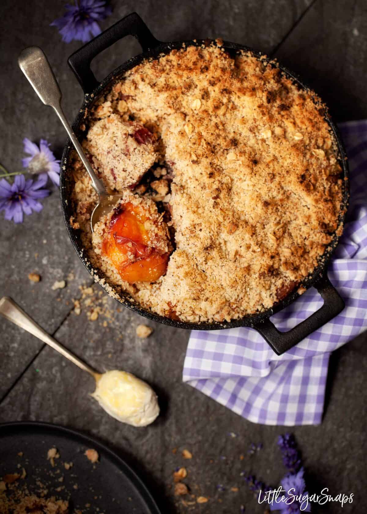 Bourbon Peach Crisp in a cast iron skillet