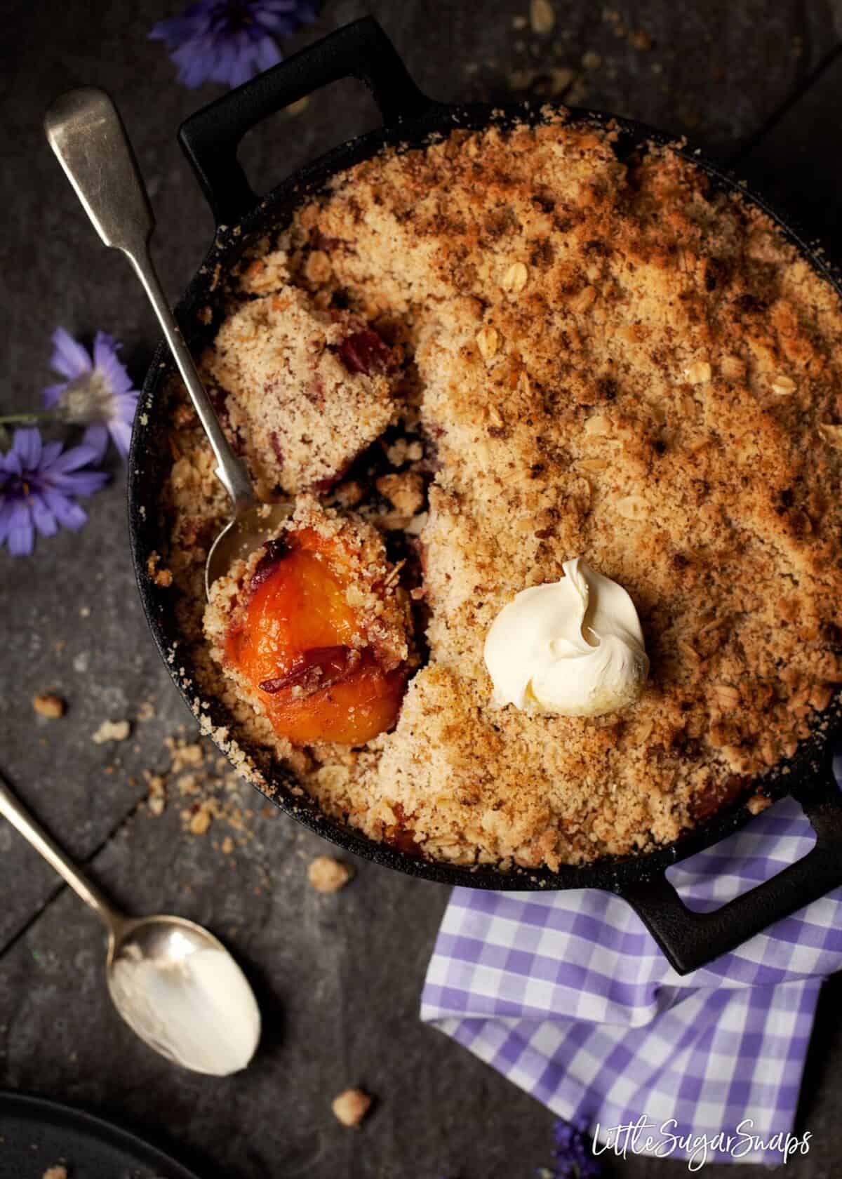 Bourbon Peach Crisp with Amaretti Crumb and cream