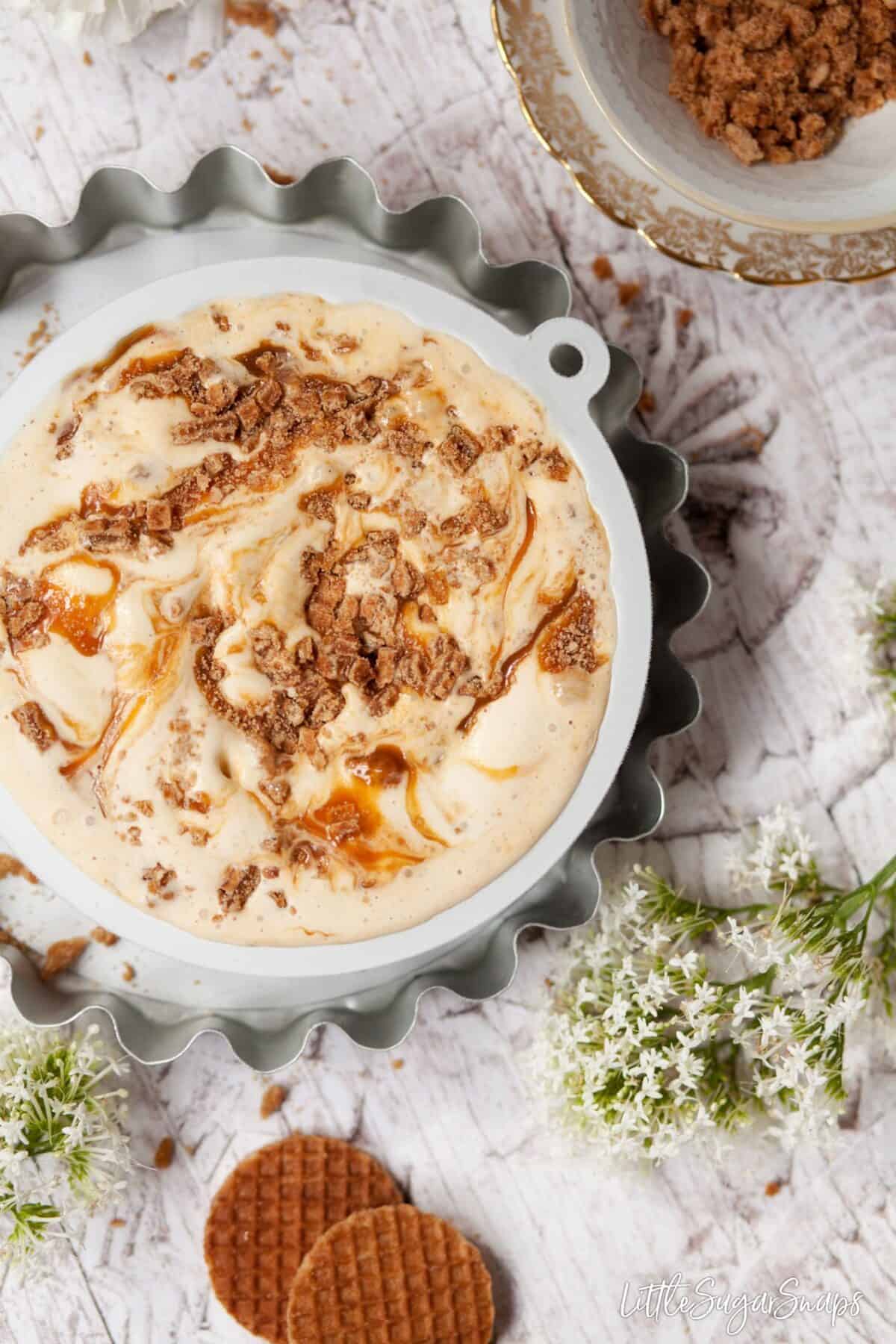 A tub of bourbon ice-cream with stroopwafel and caramel