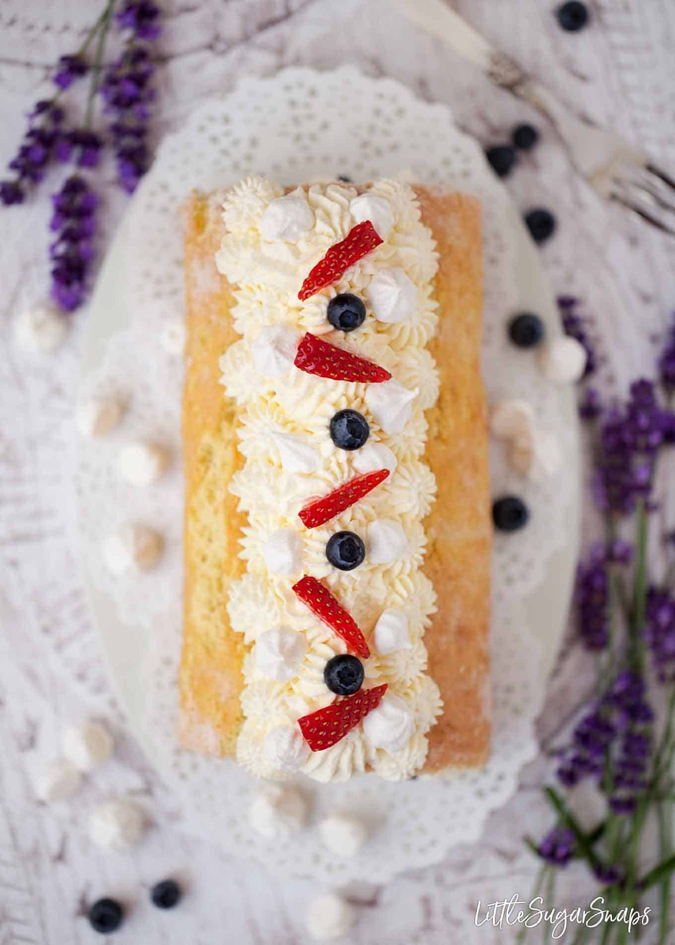 Top view of roulade with strawberries and blueberries