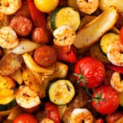 Sheet Pan Chorizo and Prawns with courgette, peppers, onion and tomatoes