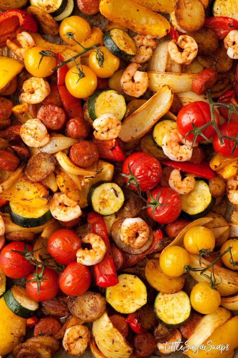 Roasted chorizo and prawns with onion, baby tomatoes, red and yellow peppers and courgette