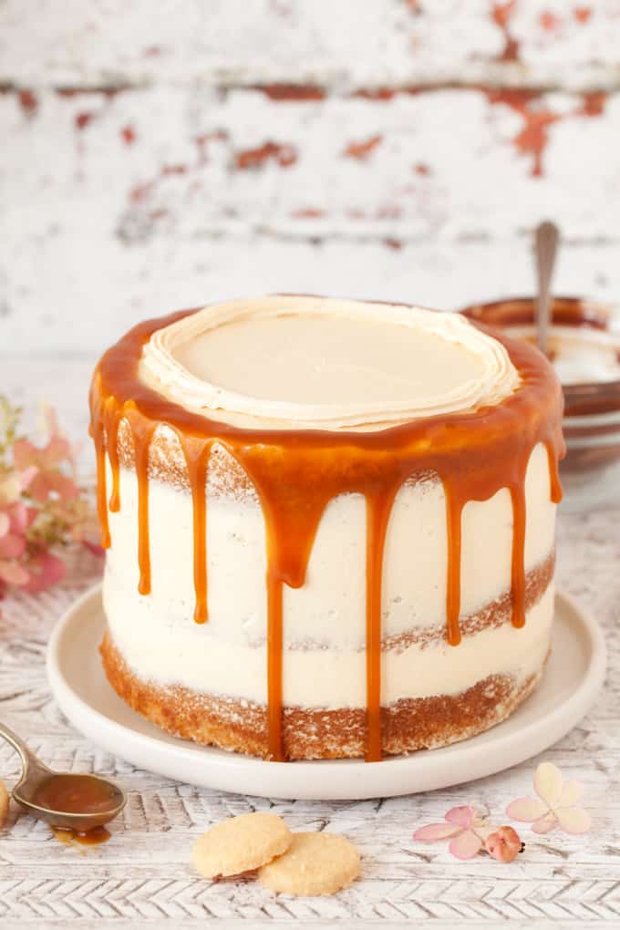Making a caramel drip cake. Mid decorating with the top still to be finished but the sauce dripping down the side of the cake